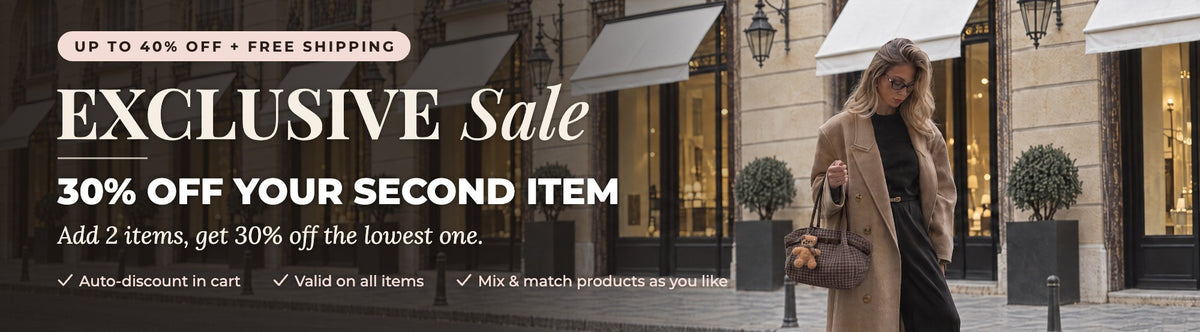 Exclusive Sale, 30% off your second item. Woman in a camel coat carrying the Oursette bag