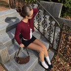 Briochelle Polka Dot Croissant Shoulder Bag - Chocolate Brown - on stone steps