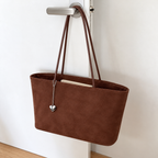 Daimée Suede-Look Shoulder Bag - Brown - hanging on a door handle
