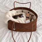Daimée Suede-Look Shoulder Bag - Brown - open on the bed with everyday essentials