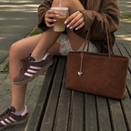 Daimée Suede-Look Shoulder Bag - Brown - on a park bench