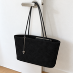 Daimée Suede-Look Shoulder Bag - Black - hanging on a door handle