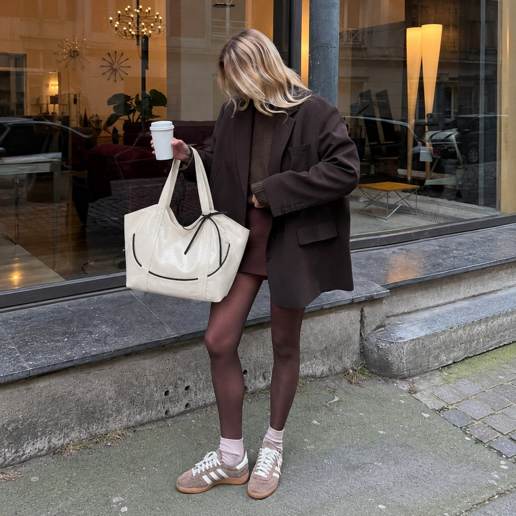 Clovara Glossy Tote Bag - White - carried with a brown blazer