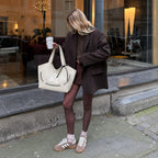 Clovara Glossy Tote Bag - White - carried with a brown blazer