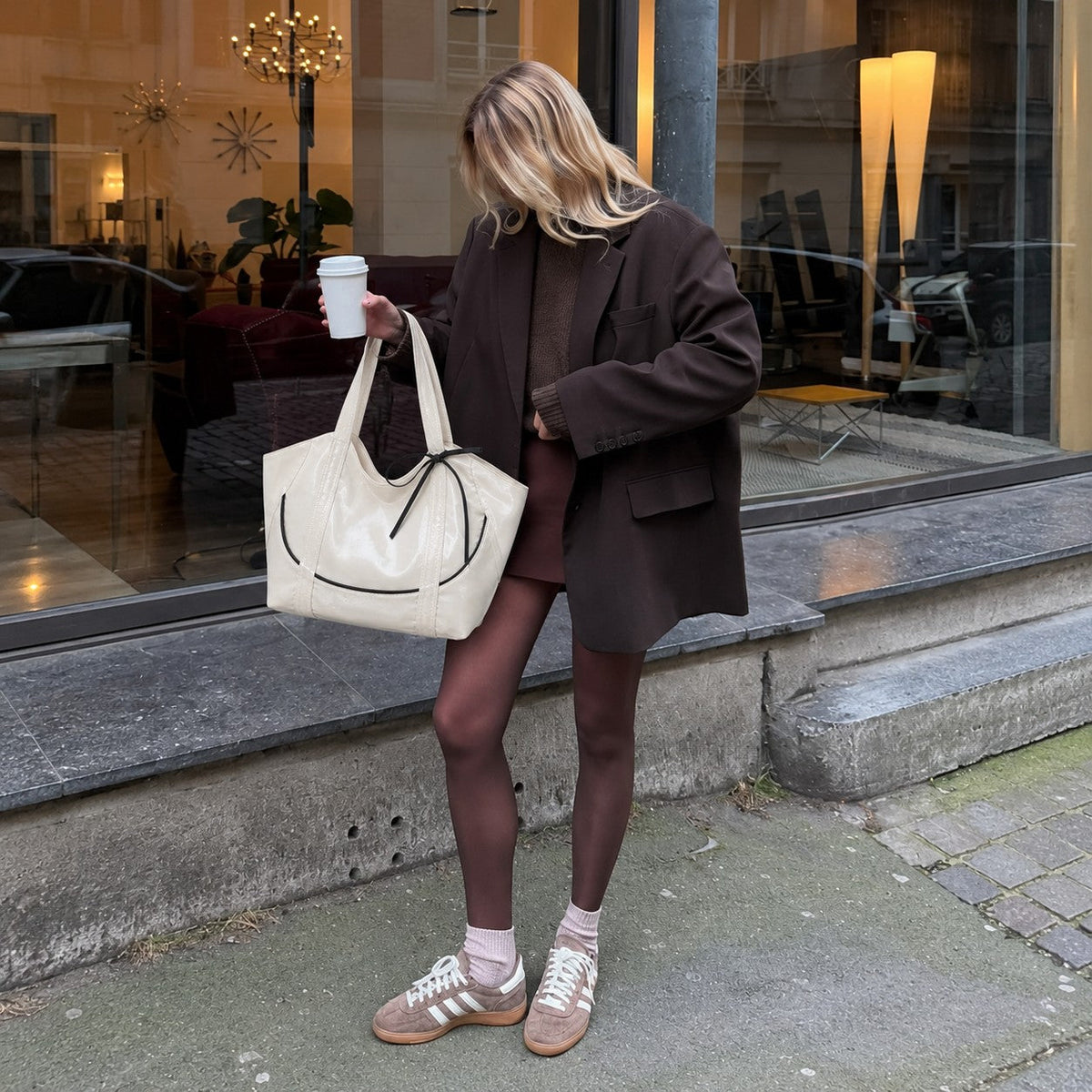 Clovara Glossy Tote Bag - White - carried with a brown blazer