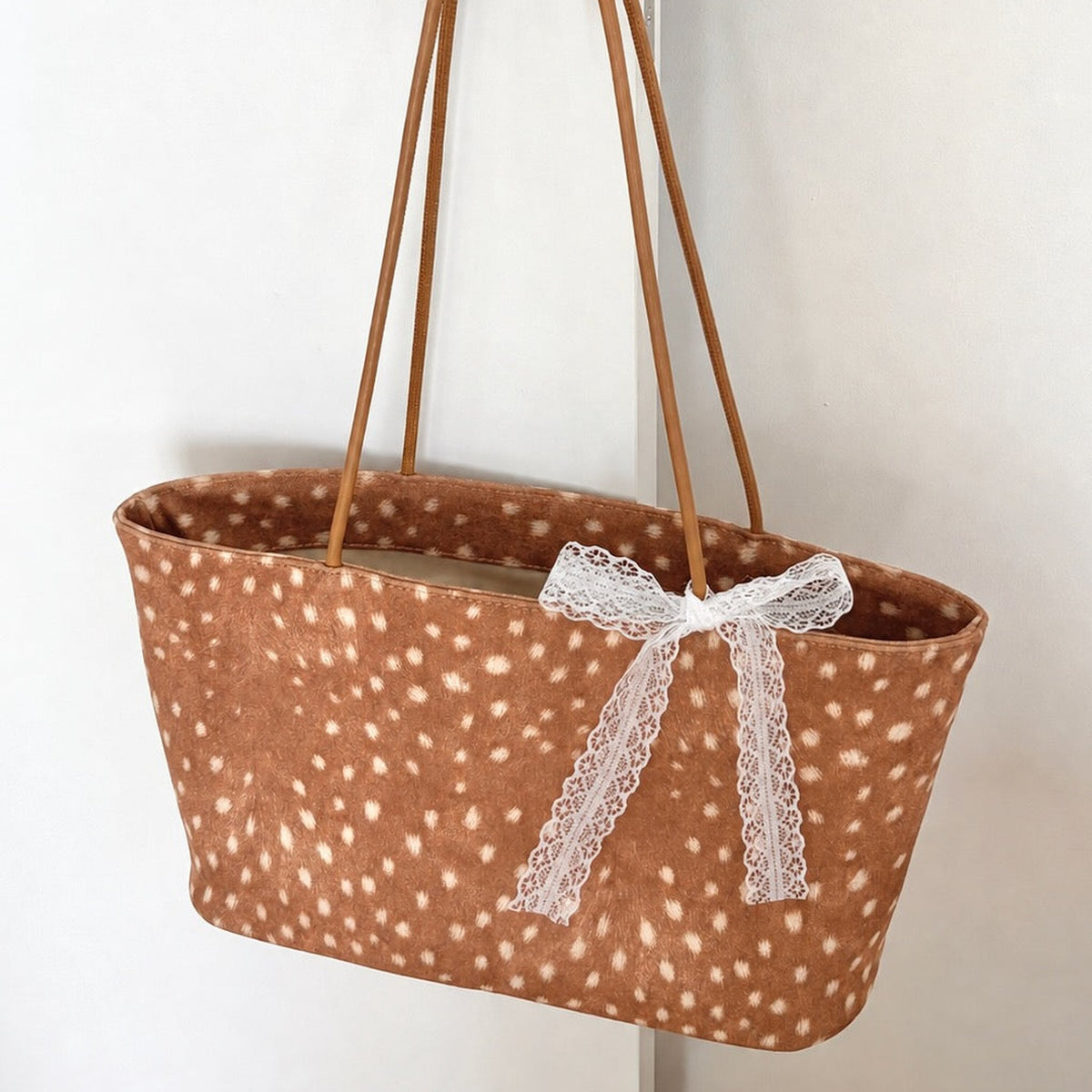 Daimée Suede-Look Shoulder Bag - Classic - hanging on a door handle