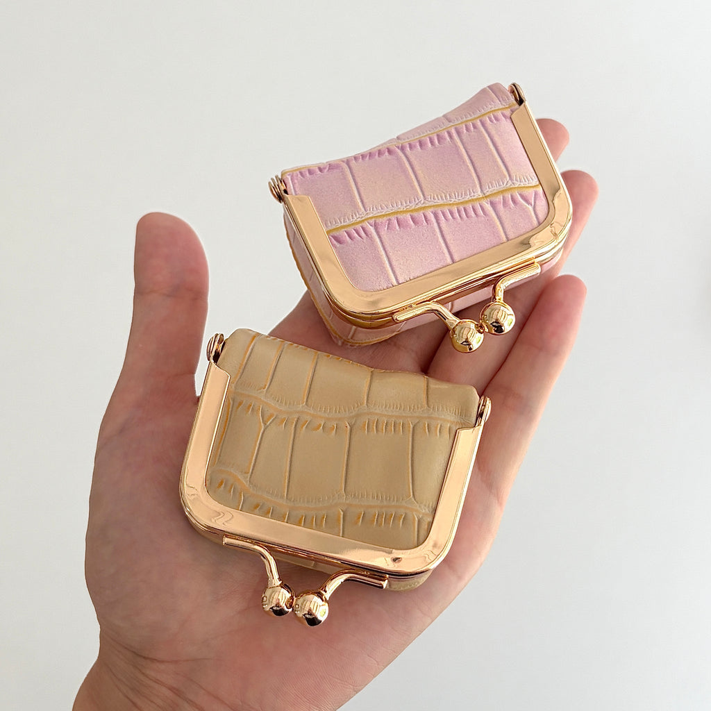 Écrinette Kiss-Lock Jewelry Case - Blush Mauve and Desert Sand in hand