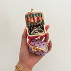 Écrinette Kiss-Lock Jewelry Case - held in hand with Grape Purple