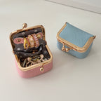 Écrinette Kiss-Lock Jewelry Case - Powder Pink open beside Powder Blue