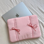 Nastrina Double Bow Laptop Sleeve - Pink sleeve with laptop on bed