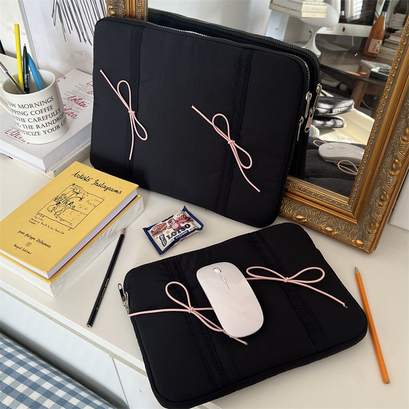 Nastrina Double Bow Laptop Sleeve - two sizes in Black on desk