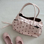 Pralinette Polka Dot Vegan Leather Shoulder Bag - flat lay with ballet flats in Pink