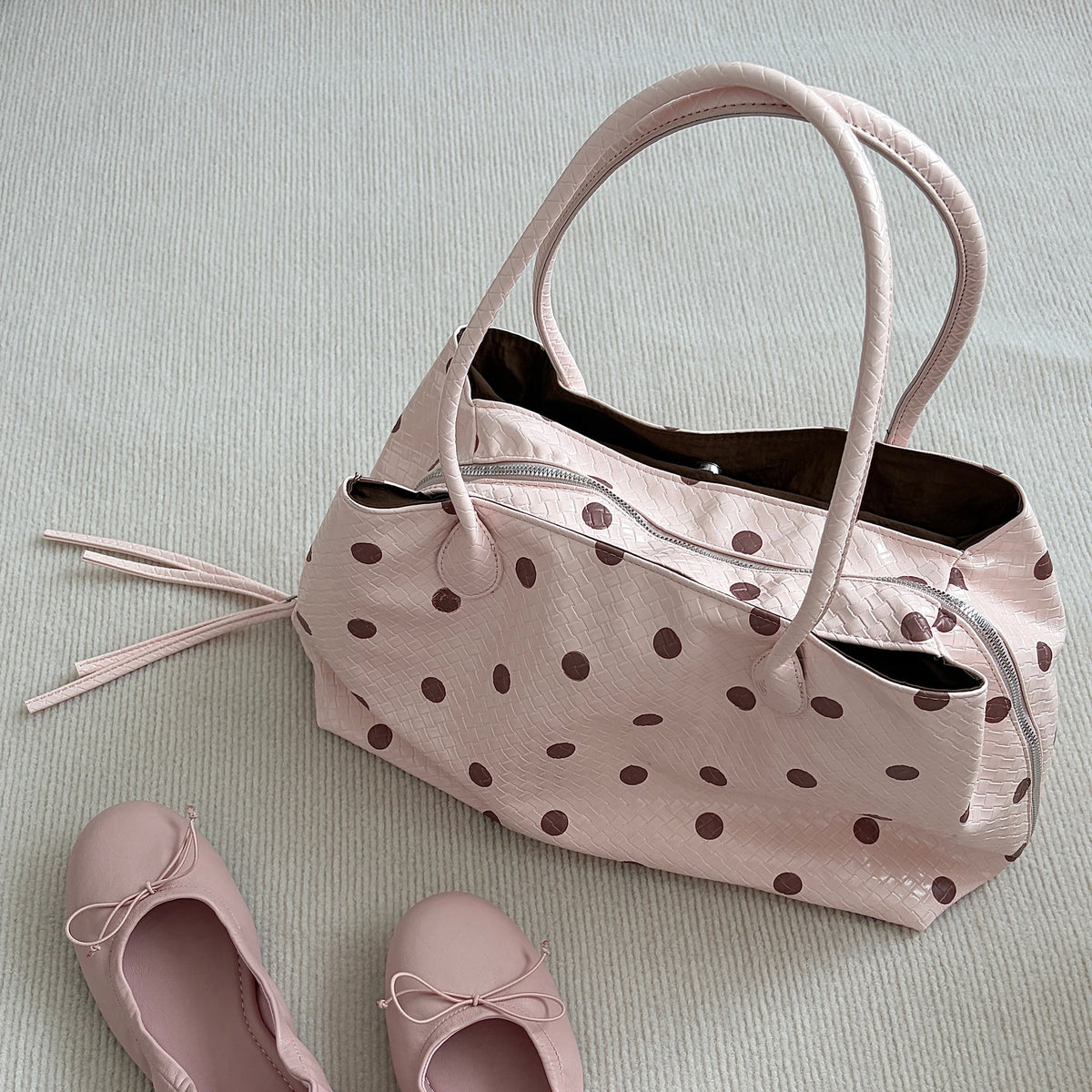 Pralinette Polka Dot Vegan Leather Shoulder Bag - flat lay with ballet flats in Pink