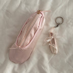 Sylphine Satin Ballet Makeup Pouch - closed pouch on white sheets