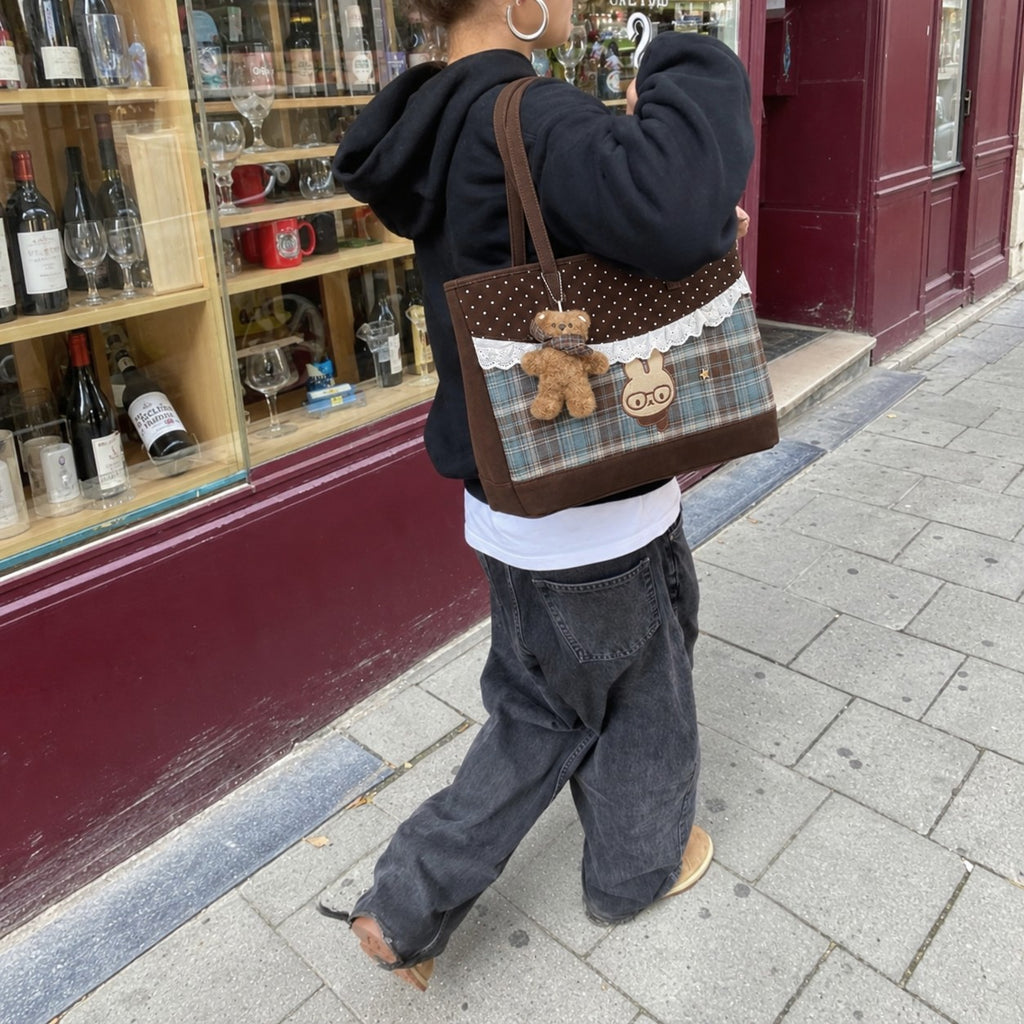 Tartinette Lace-Trim Plaid Tote Bag - Cocoa Plaid - outside a wine shop