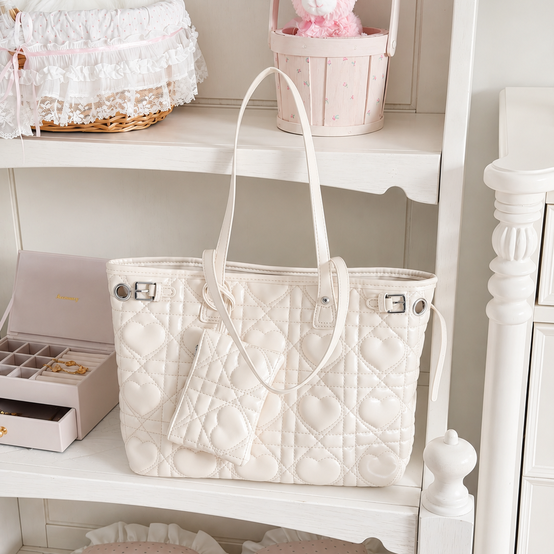 Tendréa Heart Quilted Shoulder Bag - styled on a shelf with mini pouch